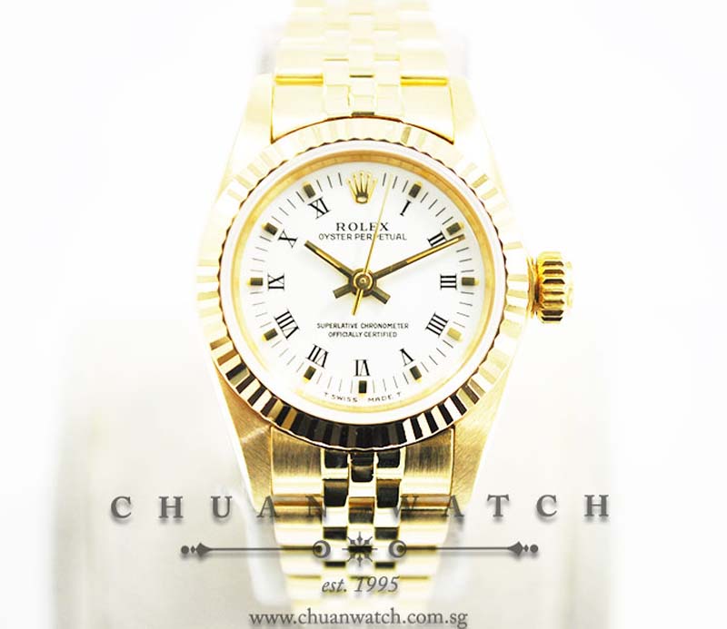 Rolex Ladies Oyster Perpetual No-Date Yellow Gold 26mm 67198 White Roman - Discontinued